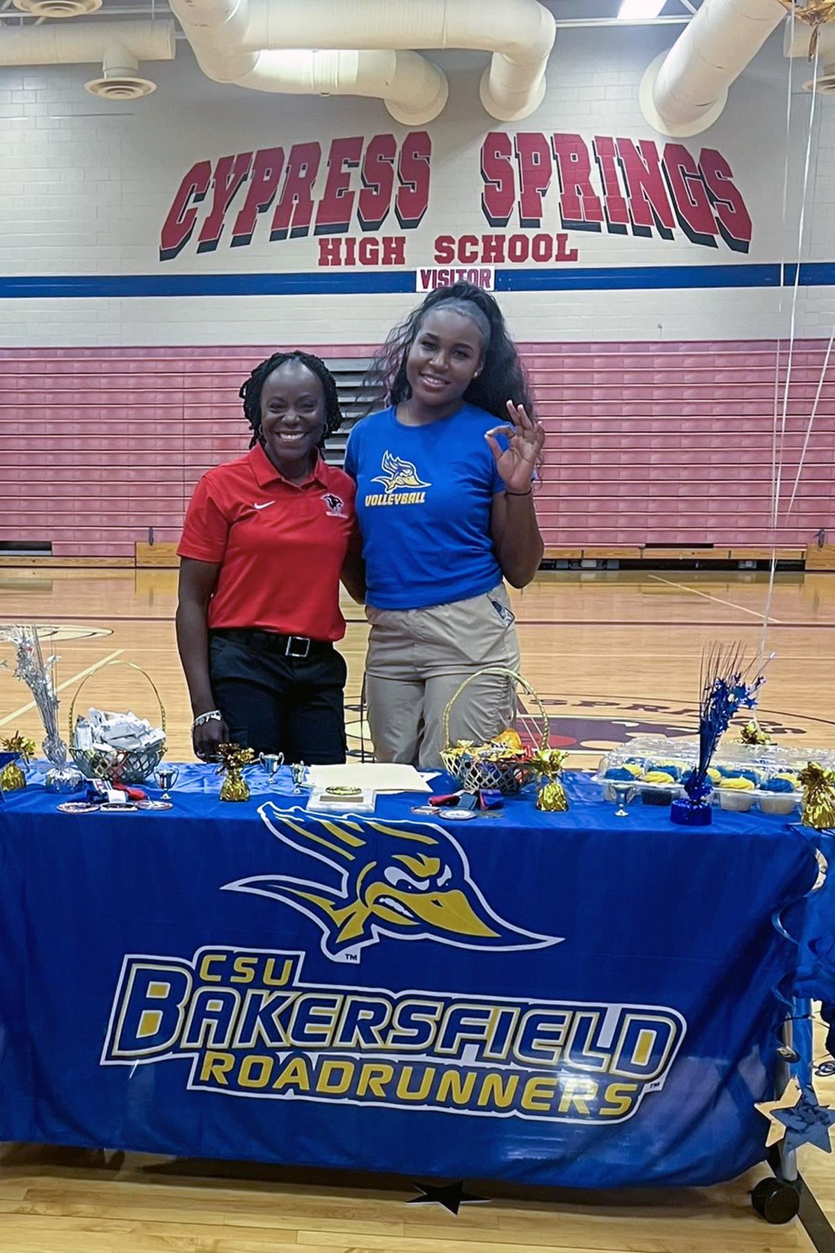 Cypress Springs High School senior Naomi Chankoumi, right, signed a letter of intent to play volleyball.